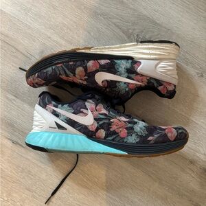 Nike Black and Blue Athletic Shoes with Floral Design